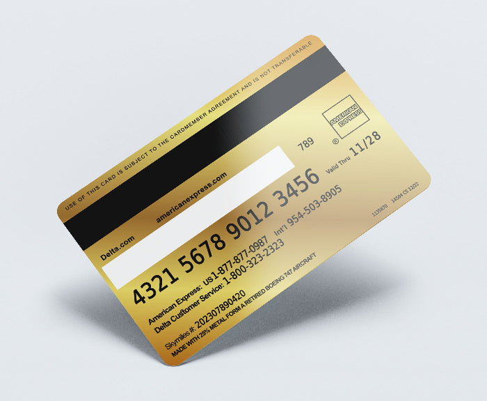 Gold American Express card on a light gray background